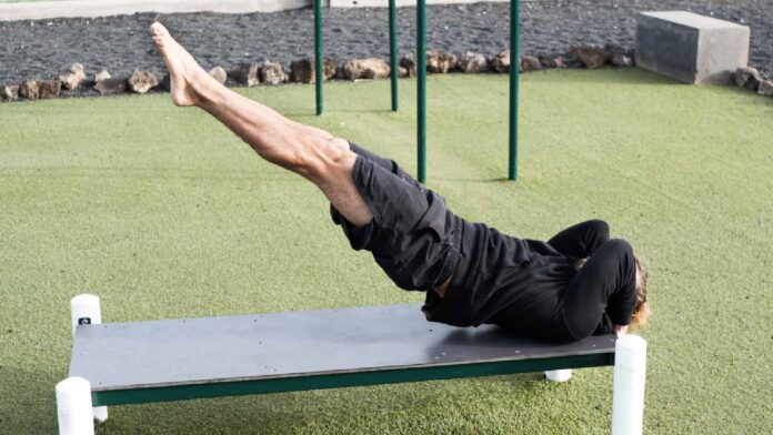 Strengthen your core with dragon flag exercise