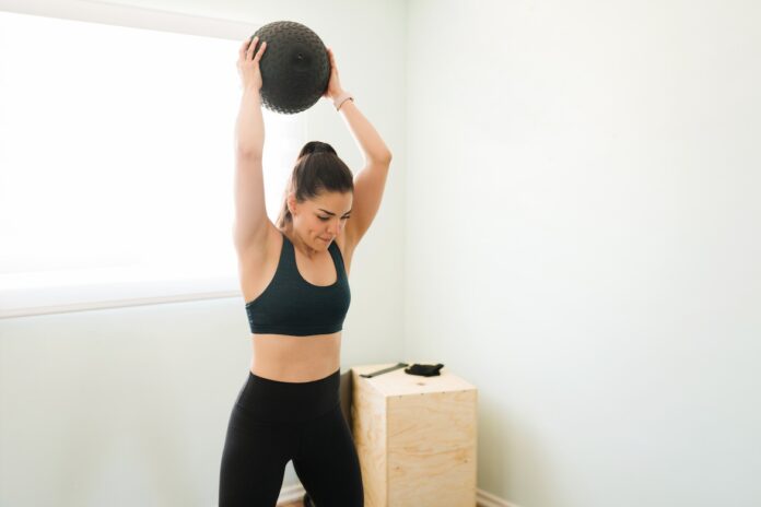 6 Slam Ball Exercises to Do for Explosive Power, Full-Body Strength, and Serious Stress Relief