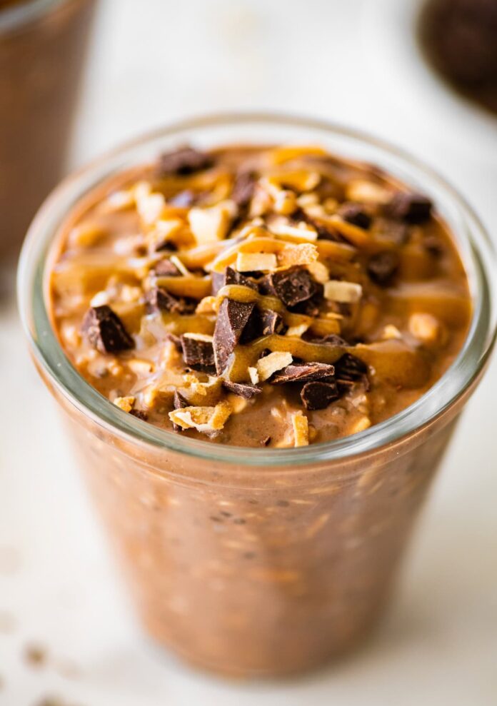 One glass jar filled with samoas overnight oats. It